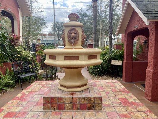 Peaceful courtyard area with water bowls throughout