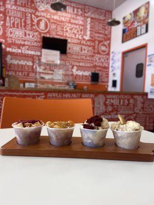 Flight: strawberry peach cobbler, Original peach cobbler , red velvet pudding, and original banana pudding