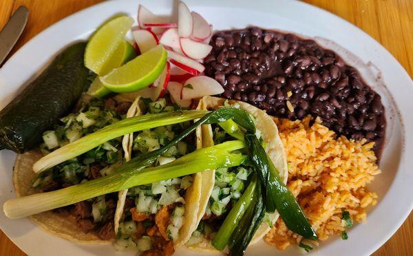 Trio taco plate with beans and rice