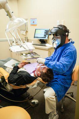 Enhanced PPE is enforced with all dental staff. We also have installed custom extra-oral aerosol evacuation systems in every room.