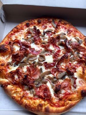 Mushroom and bacon pizza.