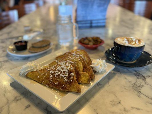 Bourbon Maple French Toast, banana foster latte, Side Home Fries, Side of Pork Sausage.