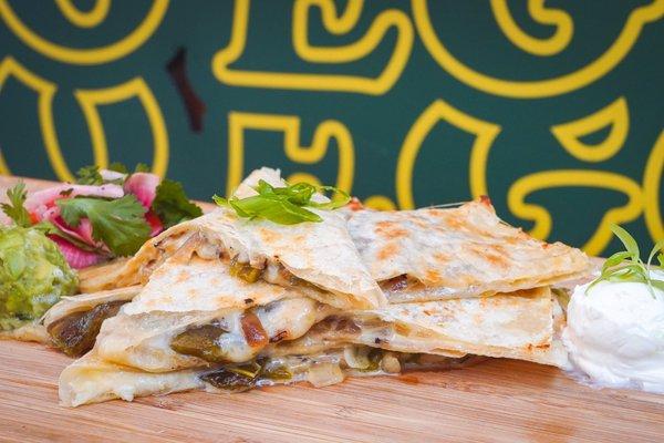 Quesadilla * queso oaxaca, grilled poblano peppers, grilled red onions, flour tortilla, guac, crema, salsa