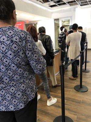 Per usual the wait is long and people standing behind me as well. #BankofAmerica sucks