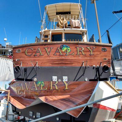 Custom boat wrap, lettering and decal. Teak and gold leaf