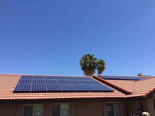 Residential solar panel installation on pitched roof.