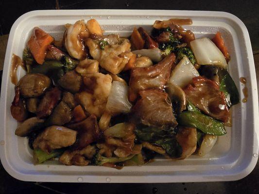 Triple Delight: chicken, pork, jumbo shrimp sautéed with veggies; special brown sauce