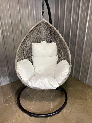 Our tear drop design swing chair. Comes in gray rattan with white cushions or black rattan with gray cushions.