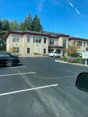 The building from the parking lot. You walk upstairs when you get inside to get to the dentist office.