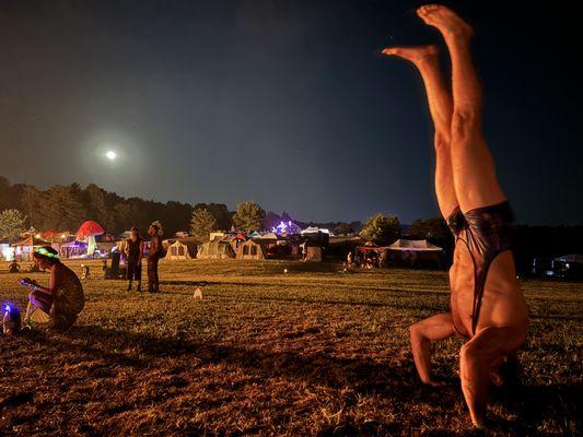 Headstand in the full moon light, naturally