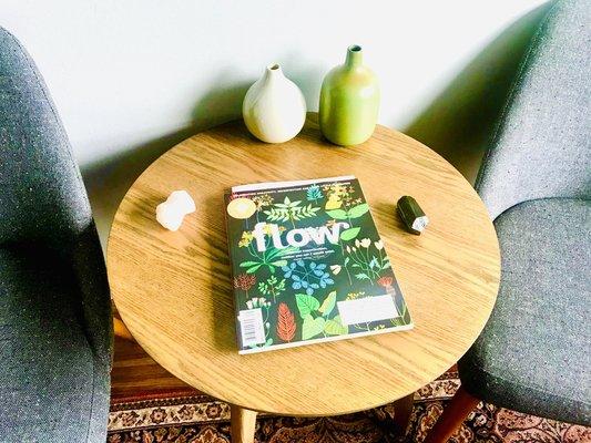 A comfortable, sun-lit waiting room with wellness literature.