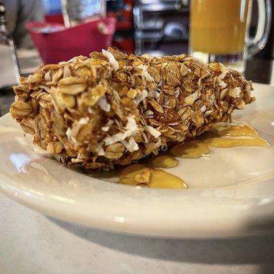 Granana:  1/2 banana coated in peanut butter, rolled in homemade granola and drizzled with honey