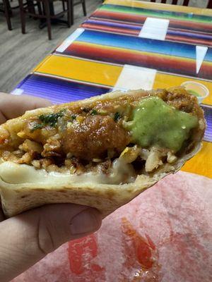 Amazing Al Pastor burrito with hot and mild sauce