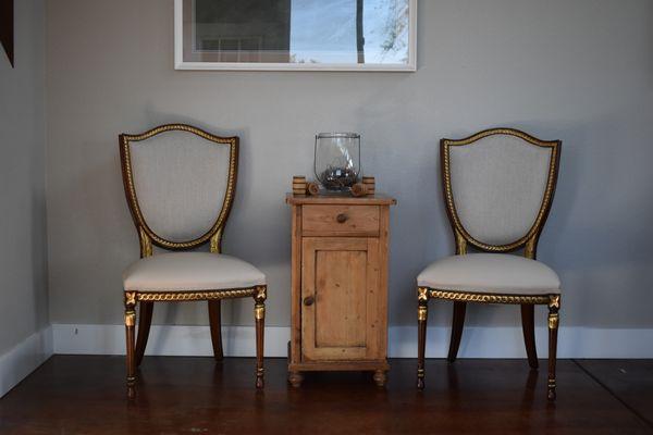 A set of chairs refurbished to restore their former glory.