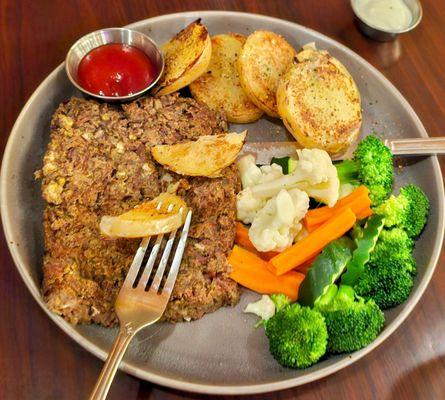 Lentil loaf with steamed veggies and roasted potatoes