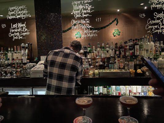 Some of the cocktail recipes on the back bar mirror