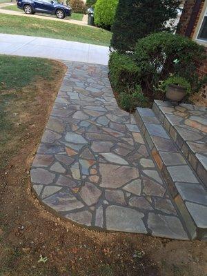 Flagstone stoop and sidewalk with concrete base