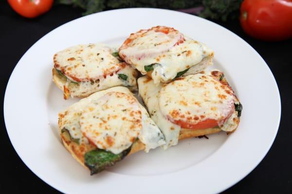 Fresh Tomatoes and Spinach on Garlic Bread with melted Mozzarella