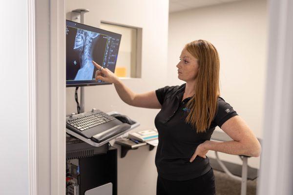 chiropractor reading x-ray scans