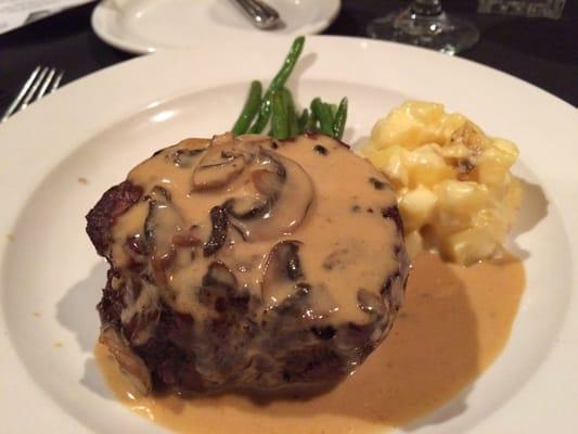 Steak Diane topped with mushroom Dijon cream sauce.