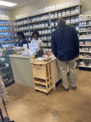 Cashier & Customer Service Representative help customer with herbal sleep aids.