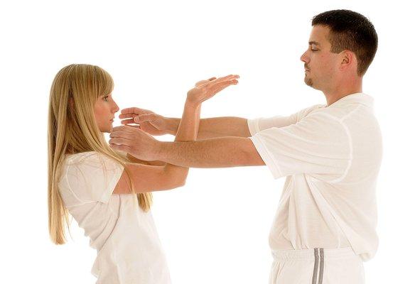 Upper palm-up hands defense against a front choke.