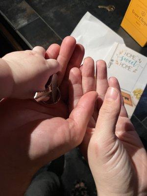 My boyfriend, 9 month old, and I holding the keys to our first home