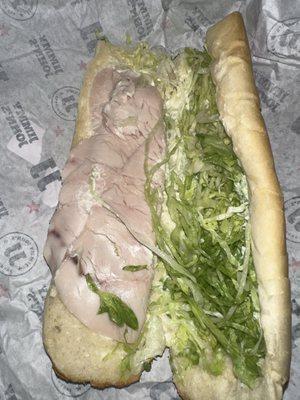 Inside of sandwich that was made poorly and incorrect.