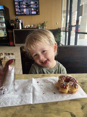 Baby eating Choco Sprinkle Donut