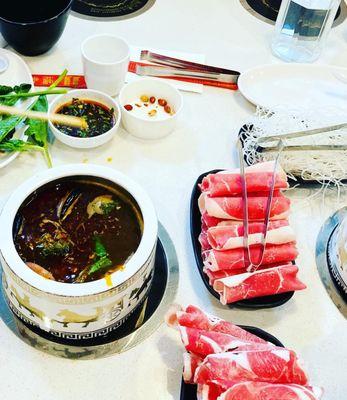 Mala Broth with dried chili peppers and sliced ginger