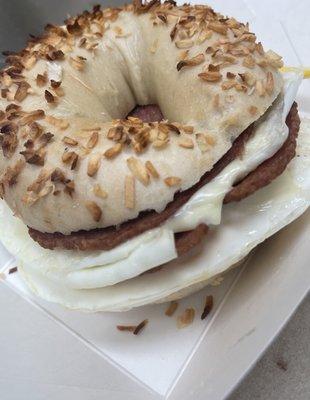 Pork roll egg and cheese on an onion bagel