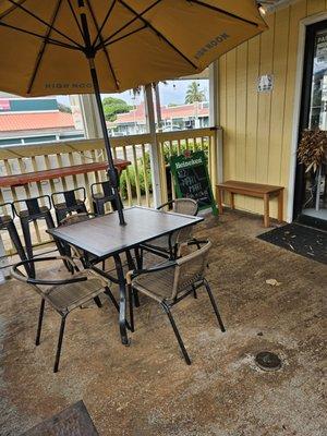 Outdoor seating... several tables under shelter