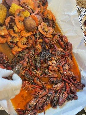 Crawfish (mysterious black stuff on the crawfish), shrimp headless, potatoes, corn