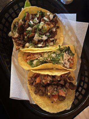 Carnitas, chicken, and steak tacos