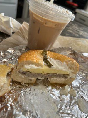 Bagel sandwich (toasted jalapeño cheddar bagel with Sausage, Egg & cream Cheese) & an iced White Chocolate Mocha