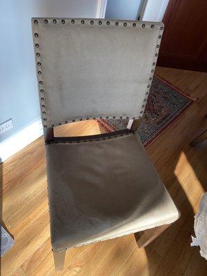 Sunken padding on a chair that was only used about 5 times. You can't even sit comfortably in this chair!