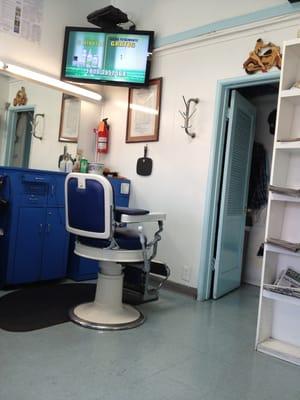 Old timey barber chair and Spanish tv ( just like Mexico)