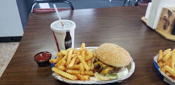 BBQ Bacon Cheddar Burger with fries and a drink.