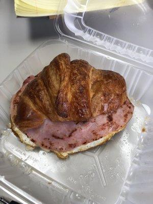 Ham and cheese breakfast sandwich on In house croissant.