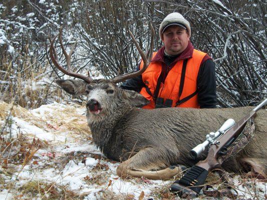 Tim Bourdeau (ND) harvests a nice mule deer buck while hunting with Stockton Outfitters during the General Rifle Season.