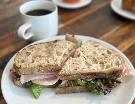 Deli sandwich with ham and drip coffee