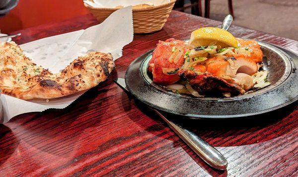 Garlic Naan on the left, Chicken tika Tika on the right.