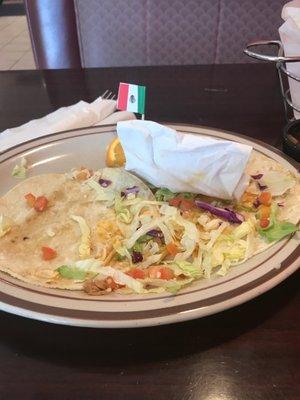 This is the plate of a satisfied customer.  Totally fat and happy after eating two carnitas tacos and chips and salsa.