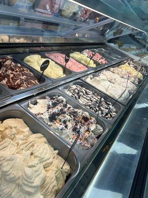 Behind the counter, you'll find the gelato case, which is brimming with an array of delicious flavors, each one handcrafted with love