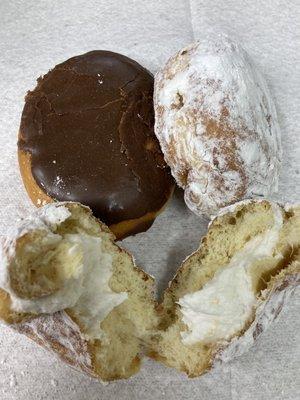 Two sugared cream and one Boston Cream donuts