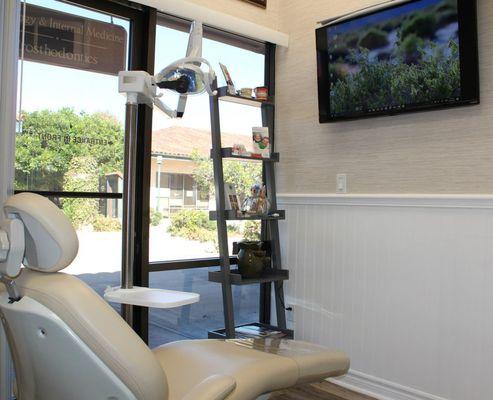 Comfortable dental chairs with natural lighting help patients feel relaxed