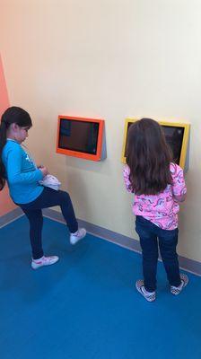 Tablets in the wall to stand and play on