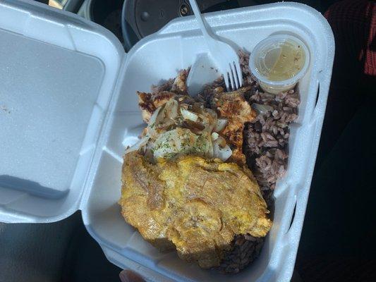 Chicken breast, moros and tostones.