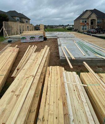 A stunning sky and concrete poured at our new construction site! This waterfront canal home is being built in the gated community of Grand H