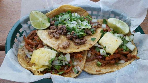 Steak taco (middle) Pastor tacos (sides)